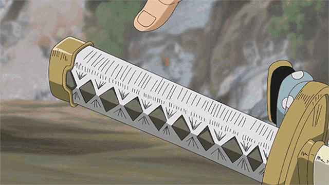 a person is holding a sword with a geometric pattern on it