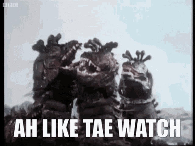a group of monsters standing next to each other with the words `` ah like tae watch '' written on the screen .