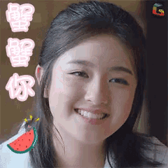 a close up of a woman 's face with a watermelon slice on her shoulder .