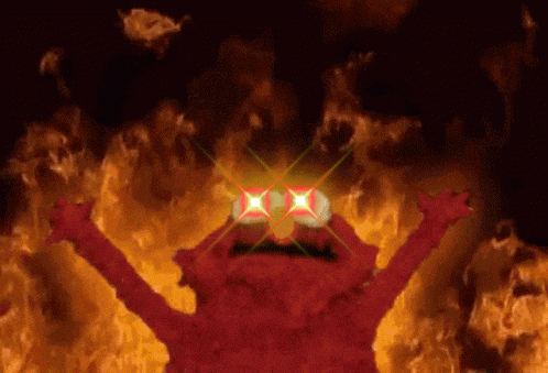 elmo from sesame street is on fire with his eyes glowing