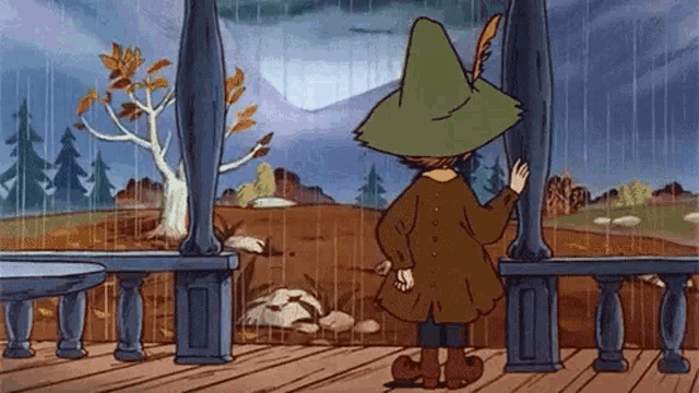 a cartoon character in a green hat is standing on a porch looking out at the rain .