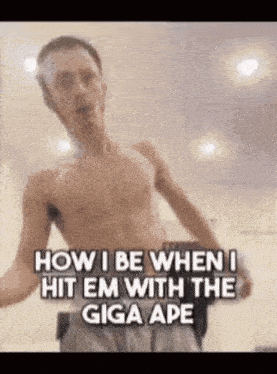 a shirtless man is standing in a room with his arms outstretched .