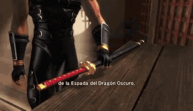 a man in a black suit is holding a sword in a room .