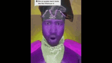 a man with purple paint on his face and a bandana on his neck .