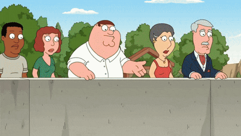 a group of cartoon characters are standing behind a concrete wall