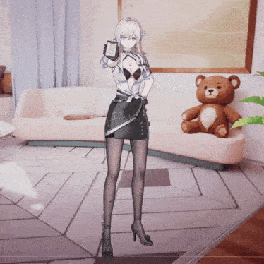 a woman standing in front of a teddy bear and a couch