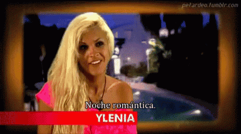 a blonde woman with the name ylenia on a red sign