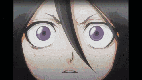 a close up of a cartoon character 's face with purple eyes