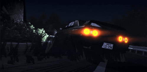 a car with a license plate that says 32-34 is driving down a dark road