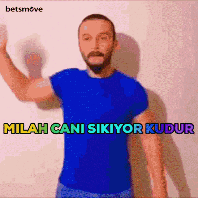 a man in a blue shirt with the words " milan cani sikiyor kudur " on the bottom
