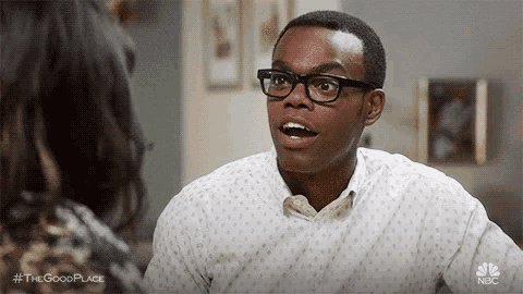 a man wearing glasses is talking to a woman and making a surprised face .