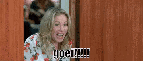 a woman is standing in a doorway with a surprised look on her face and the words go !!!