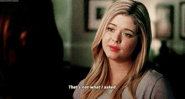 a woman is talking to another woman and says that 's not what i asked