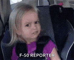 a little girl is sitting in a car seat and making a funny face and saying f- 50 reporter .