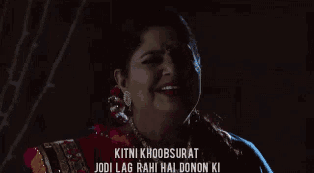 a woman is making a funny face with the words kitni khoobsurat jodi lag rahi hai donon ki above her