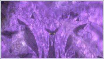 a close up of a monster 's mouth with glowing eyes and sharp teeth .