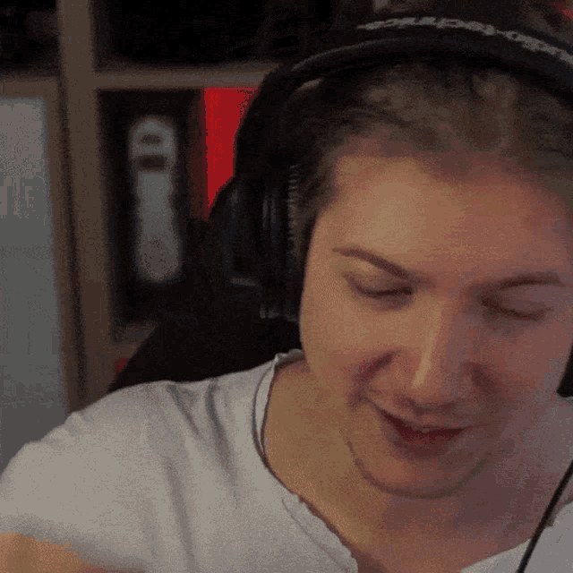 a close up of a person wearing headphones with the word techno on the headband