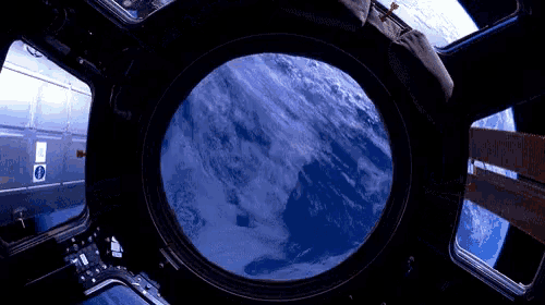 a view of the earth from the inside of a space ship