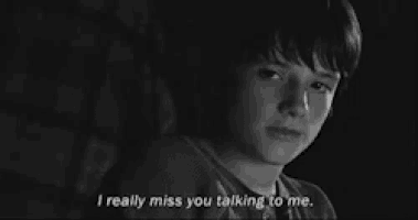 a black and white photo of a boy with the words i really miss you talking to me .