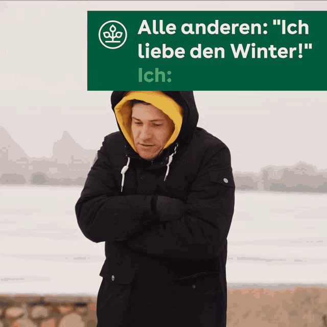 a man with his arms crossed stands in front of a sign that says alle anderen ich liebe den winter ich