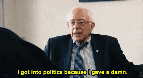 a man in a suit and tie is talking about politics