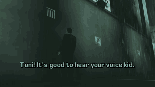 a man standing in front of a wall that says toni it 's good to hear your voice kid on it