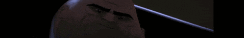 a close up of a cartoon character 's face with a serious look on his face .