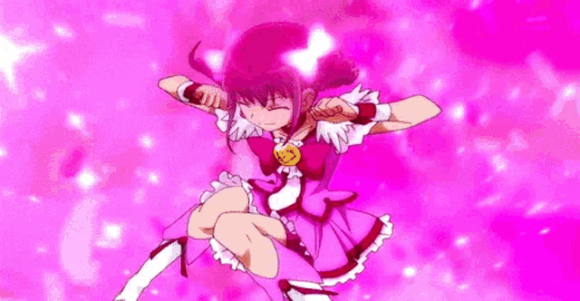 a girl in a pink dress is holding a microphone in her hands .