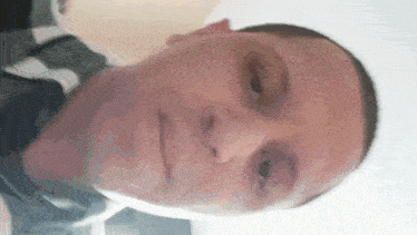 a close up of a man 's face and neck