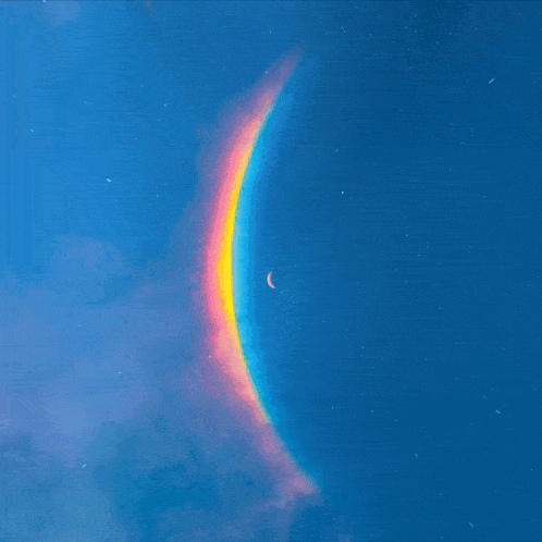 a blue sky with a rainbow and a crescent moon in it
