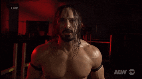 a shirtless wrestler says you 're crap in front of a tnt logo