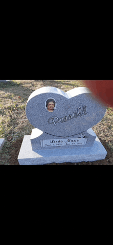 a gravestone in the shape of a heart with the name parnell on it