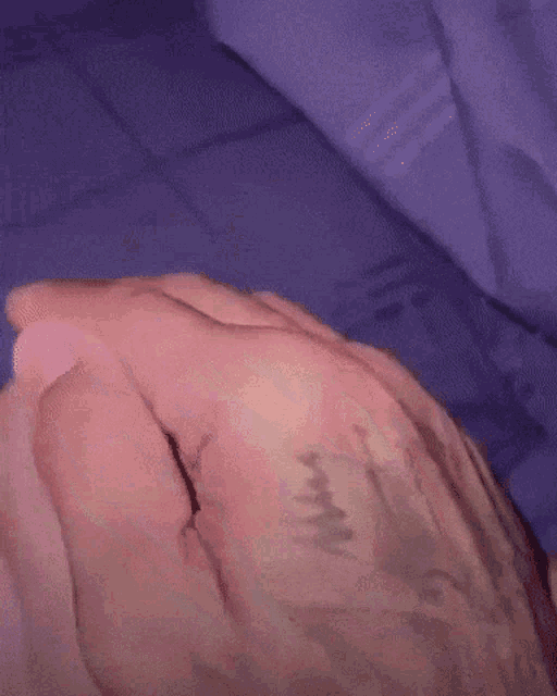a close up of a person 's hand with a tattoo on it that says ' i love you '