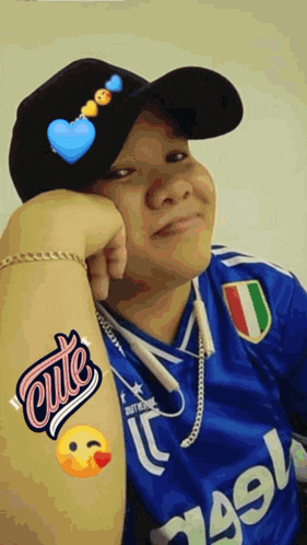 a person wearing a hat and a jersey that says cute