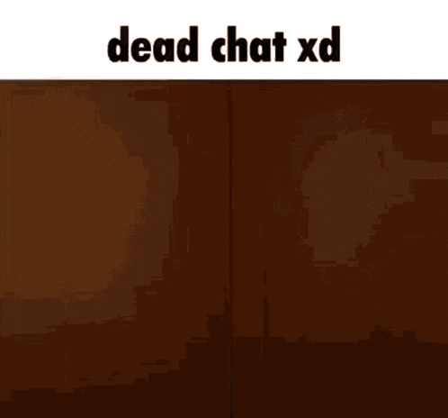 a man in a suit is standing in a dark room with the words dead chat xd on the bottom