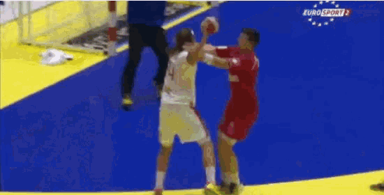 a man in a red jersey with the number 4 on it is playing basketball