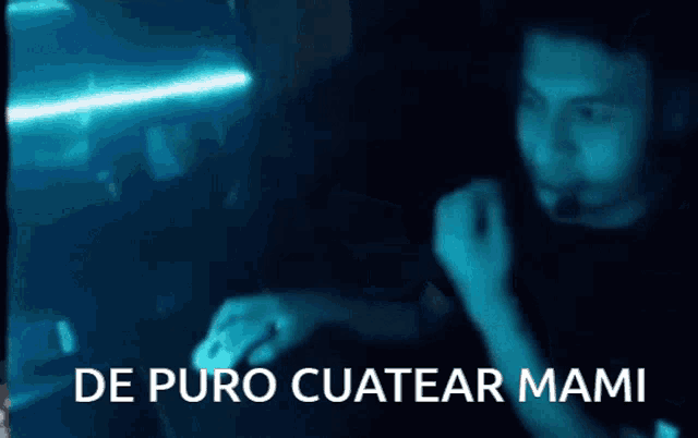 a blurry photo of a person with the words de puro cuatear mami written in white