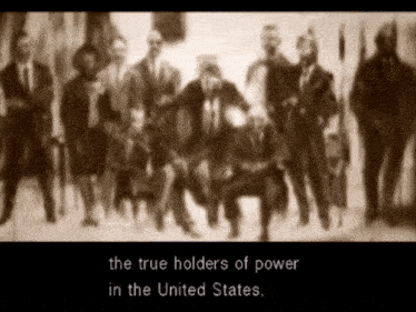 a blurred image of a group of people with the words " the true holders of power in the united states "