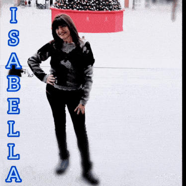 a woman is standing on a ice rink with the name isabella written on the bottom