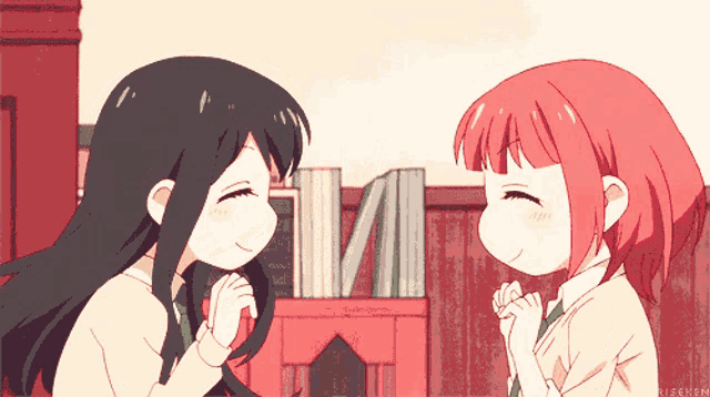 a couple of anime girls are standing next to each other with their hands folded