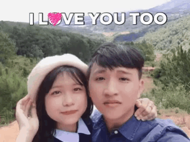 a boy and a girl are posing for a picture with the words " i love you too " written above them