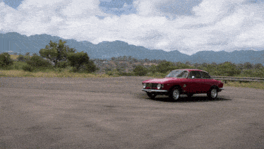 a red car with the letter a on the side of it