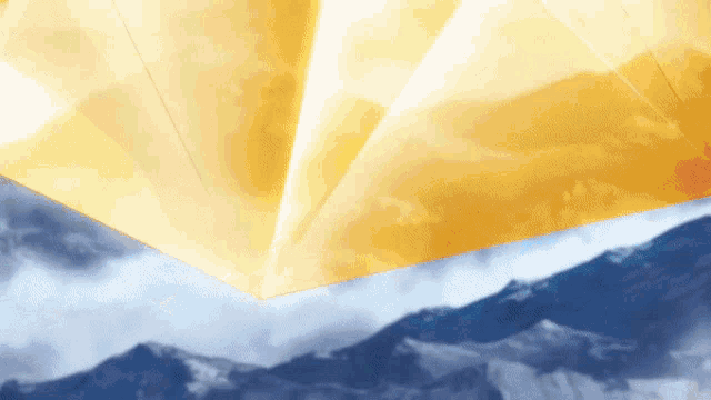 a picture of a mountain range with a yellow triangle in the foreground