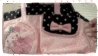 a pink and black polka dot purse with a bow on it
