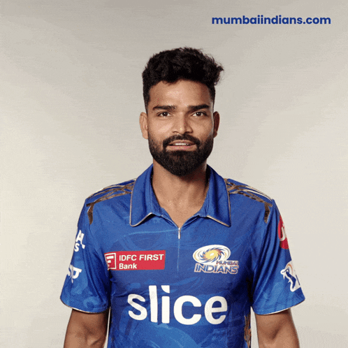 a man with a beard wears a blue shirt that says slice
