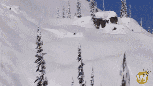 a snowy mountain with the letter w on the bottom left