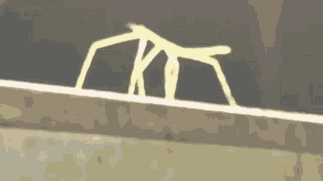 a blurred image of a tree with a yellow star in the foreground