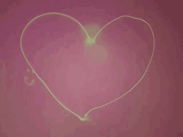 a drawing of a heart with a green line going through it