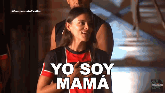 a woman in a red and black shirt with yo soy mama written on her chest