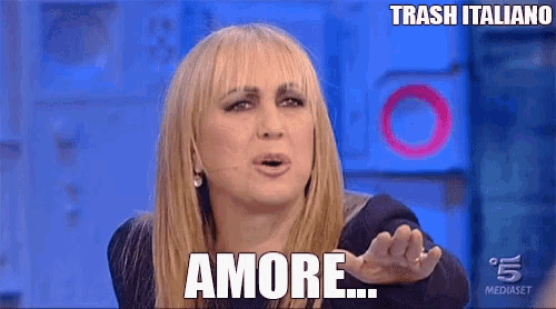 a woman with blonde hair says amore on a television screen